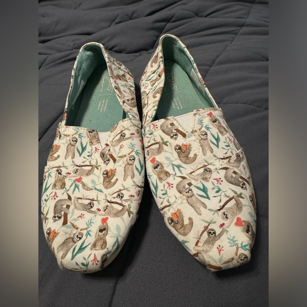 Brand new, never worn women’s size 7.5 sloth print Tom’s shoes